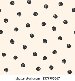Seamless repeat pattern with hand-drawn scribble sketched polka dot on a cream background