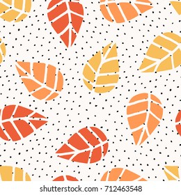 Seamless repeat pattern with leaves and dots in red, orange and yellow on white background. Nature inspired fabric, gift wrap, greeting card design.