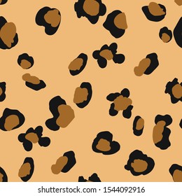 Seamless repeat pattern with loose hand drawn leopard cheetah wild cat spots in ocher brown and black