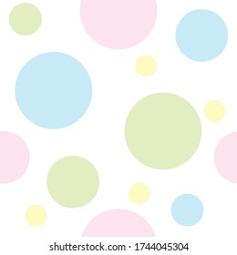 Seamless repeat pattern of pastel coloured circles or dots on a white background.  Tile, wallpaper, fabric design.