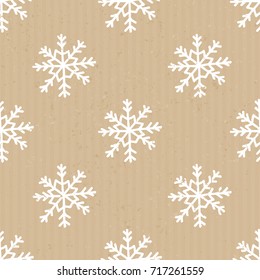 Seamless repeat pattern with snowflakes in white on craft paper background.