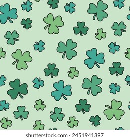 Seamless repeat pattern of St. Patrick's Day green clovers on a light green background.