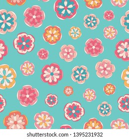 Seamless repeat pattern of stylized bright colourful flowers on a turquoise background. A pretty tossed vector pattern ideal for summer projects.