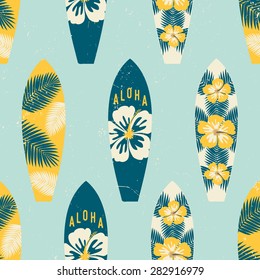 Seamless repeat pattern with surf boards in yellow and blue on a light blue background.