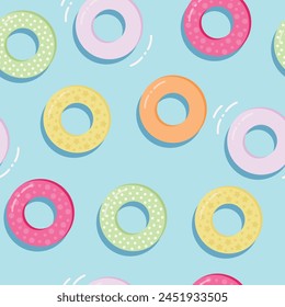 Seamless Repeat Pool Pattern with an ocean blue background, colorful donut shaped pool floats and small waves.