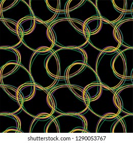 Seamless repeating pattern of bright colorful Mardi Gras beads on a black background
