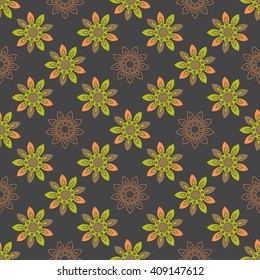 Seamless repeating pattern with colored abstract flowers on a black background.