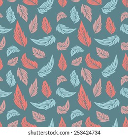 Seamless repeating pattern of colored leaves on a blue background
