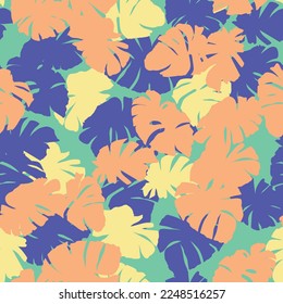 Seamless repeating pattern of colorful tropical leaves