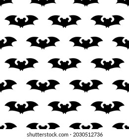 Seamless repeating pattern with Halloween symbols. Design of silhouettes for the holiday Halloween. for postcard, fabric, banner, template, wrapping paper. Vector flat illustration