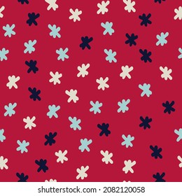 Seamless repeating pattern with hand drawn flakes. Festive red backound for for wrapping paper, surface sign and other design projects. Christmas, New Year concept