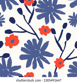 Seamless repeating pattern with hand painted flower blossoms and branches in red, blue and white. Hand drawn vector illustration, perfect for fabrics, greeting cards, wrapping paper, packaging.