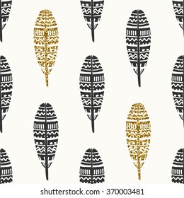 Seamless repeating pattern with ornate feathers in black and gold glitter on cream background.