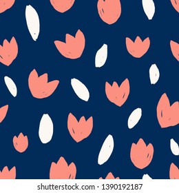 Seamless repeating pattern with simple leaf and tulip floral shapes in coral and white on dark blue background. Cute colorful floral texture fabric, wallpaper, stationery, packaging design.