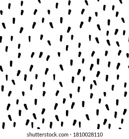 Seamless repeating pattern with tiny hand drawn speckles. Black and white vector background for surface design and other design projects
