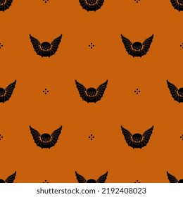 Seamless repeating pattern with winged skulls. Halloween design. Human dead head with bat wings. Medieval death symbol. Memento mori. Black silhouettes on orange background.