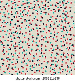 Seamless repeating spotted pattern with tiny colorful hand drawn confetti-like dots. Christmas, New Year, snowy winter, sky concept. Vector background for wrapping paper, other design projects