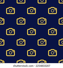 Seamless repeating tiling camera outline flat icon pattern of oxford blue and sandstorm color. Background for desktop.