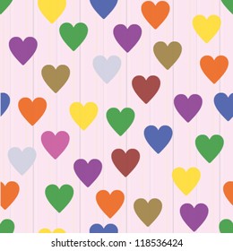 Seamless retro pattern with colorful hearts and pink background