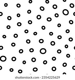 Seamless rings pattern. Black hand-drawn oval isolated on a white background. Doodle dots cozy ovate ornament. Vector dotted illustrations with circles for wallpaper, posters, wrapping paper, fabric