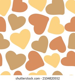 Seamless romantic pattern with big yellow and brown hearts. White background. Fashion design template, greeting cards, printing, Valentine's Day, vintage textiles. Vector texture.