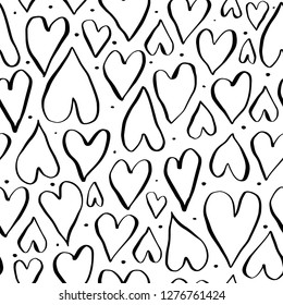 Seamless romantic pattern with hand drawn ink hearts. Doodle heart on white background. Ready template for design, postcards, print, poster, party, Valentine's day, vintage textile. Vector.