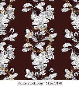 Seamless royal luxury golden baroque damask vintage. Vector pattern background wallpaper with gold antique floral medieval decorative flowers, leaves and gold pattern ornaments on brown background.