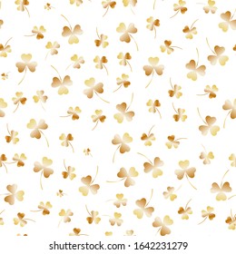 Seamless Saint Patricks Day pattern. Golden clover leaves on a white background. Realistic vector illustration, traditional folk holiday symbols or festive decorations, vector