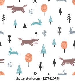 Seamless scandinavian pattern with cute wolf, hares and trees. Forest background.