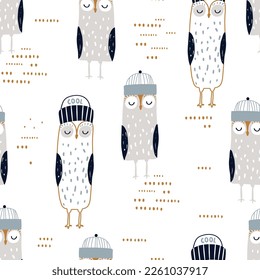 Seamless scandinavian style pattern with cute  owls in beanie hats. Childish hand drawn owl birds background. Ideal for fabrics, textiles, apparel, wallpaper.