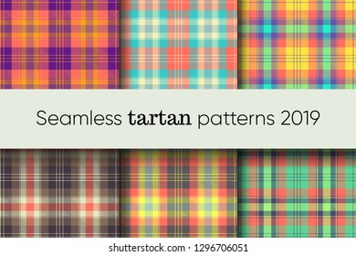 Seamless Scottish tartan kilt patterns in trendy 2019 colors based on mellow living coral. Can be used as a background, a backdrop, a texture or textile print. Vector graphic.