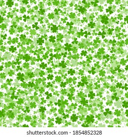 Seamless shamrock or clover leaves flat design green backdrop pattern vector illustration isolated on white background. St Patricks Day shamrock symbols decorative elements.