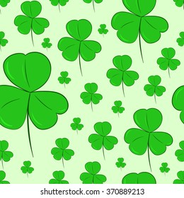 Seamless shamrocks on green