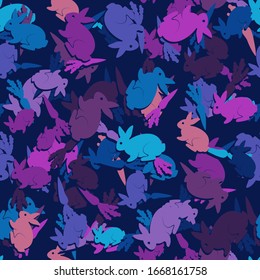 Seamless silhouette pattern of a hare and carrot on a dark blue background. Vector image eps 10