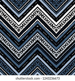 Seamless silver metallic ethnic zigzag chevron pattern. Hand drawn colorful geometric background. Striped tribal motifs. Vector illustration