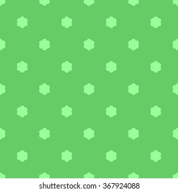 Seamless simple flat pattern with light green spring flowers on a bright green grass background.