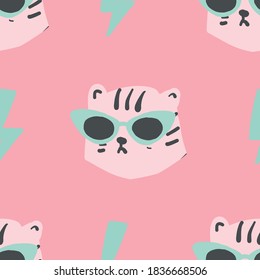 seamless simple leopard head with pink cat eye glasses seamless repeat light pink pastel pattern. Trendy tiger pattern.