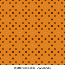 Seamless small abstract geometrical pattern. Black polka dots on orange background. Halloween colors.