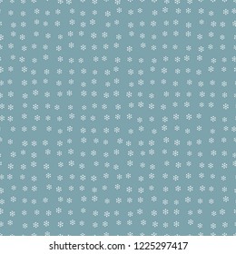 Seamless small white snowflakes pattern on a blue background
