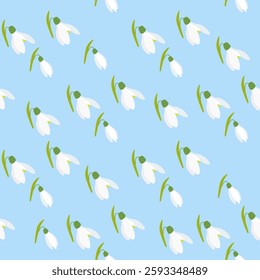Seamless snowdrops floral pattern featuring delicate white flowers on a blue background. Ideal for textile design, packaging, wallpaper. Vector illustration
