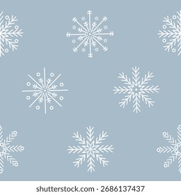 Seamless snowflake pattern on pastel blue background, winter festive style