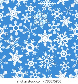 Seamless snowflakes pattern on blue background.