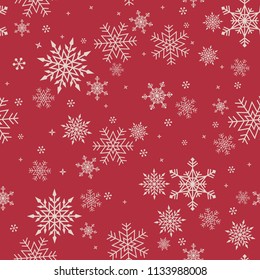 Seamless snowflakes pattern on red background