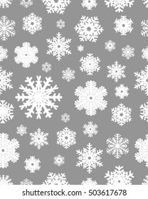Seamless snowflakes pattern, white on a gray background