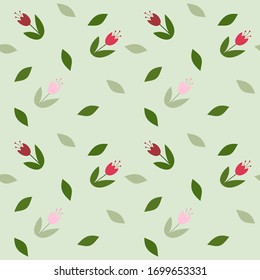 
Seamless spring vector pattern with the image of stylized flowers of tulips and individual leaves on a light green background in a flat style. This is great for scrapbooking or notebook covers.