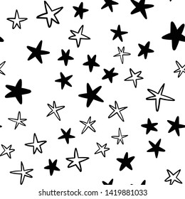 Seamless stars pattern. Hand drawn star doodles texture background.
