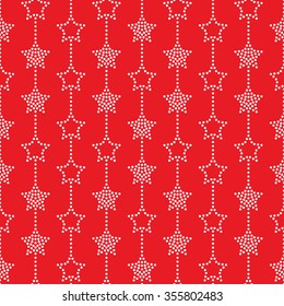 Seamless stars pattern on red background. Chevrons of stars. Dotted star shapes in garlands. Christmas beads pattern. Christmas holiday pattern of garlands. Vector Regular Texture