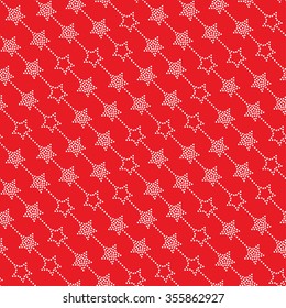 Seamless stars pattern on red background. Chevrons of stars. Dotted star shapes in garlands. Christmas beads pattern. Christmas holiday pattern of garlands.  Vector Regular Texture
