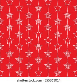 Seamless stars pattern on red background. Chevrons of stars. Dotted star shapes in garlands. Christmas beads pattern. Christmas holiday pattern of garlands.  Vector Regular Texture