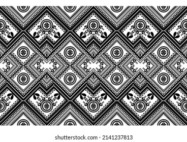 A seamless striped geometric pattern in ethnic vector texture. Black and white abstract design.